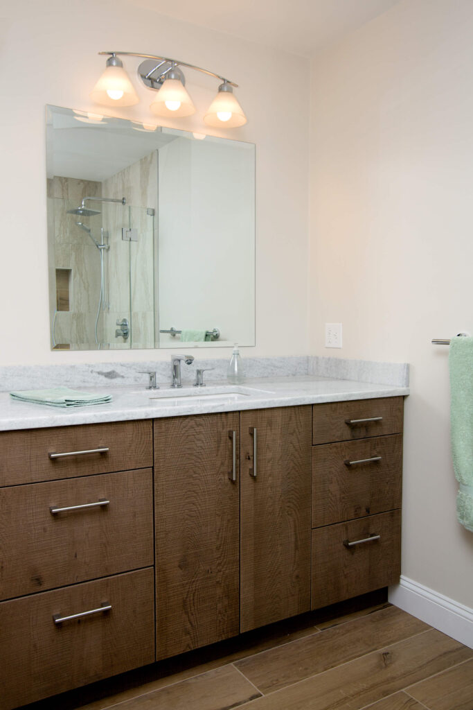 brown bathroom cabinet with white interior